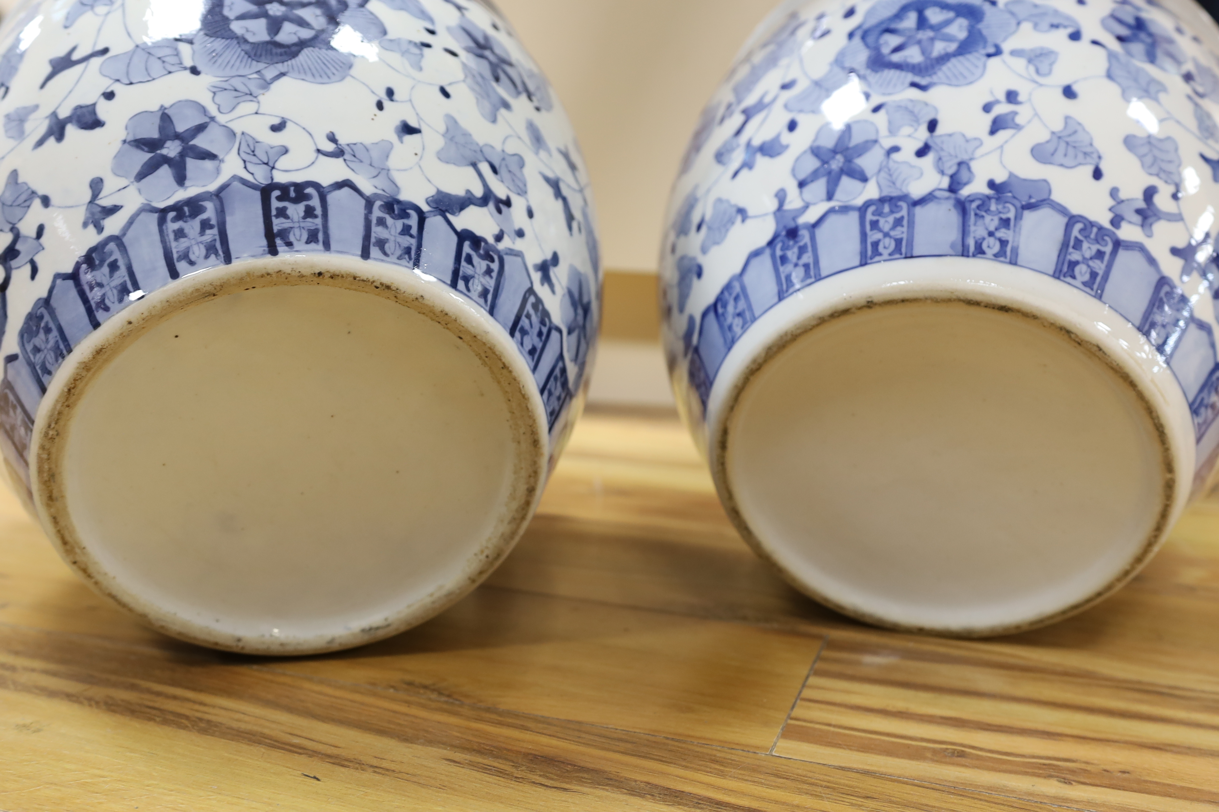 A pair of 20th century Chinese blue and white fish bowls, 29cm high